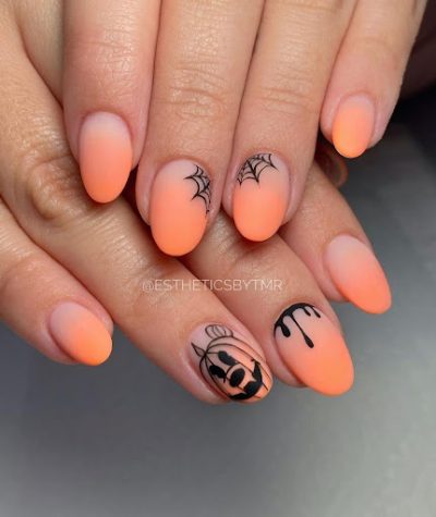 The orange nail color, in combination with black, seems like the perfect way to glamorize yourself for Halloween.