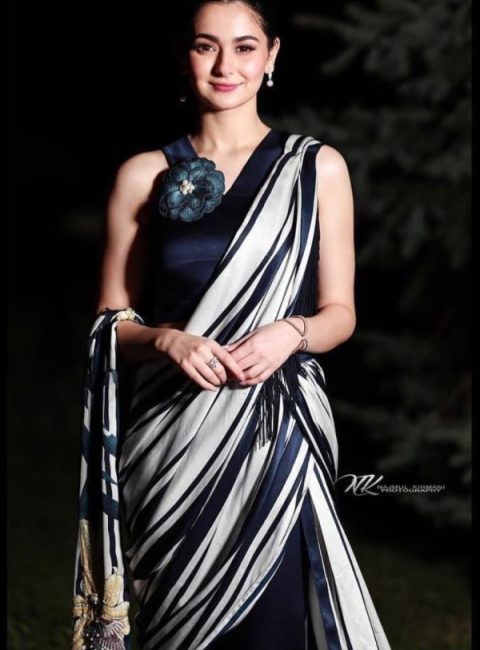 Hania Amir is truly a vision to behold in this stunning black saree with a floral touch. With light nude makeup and graceful earrings, Hania amir takes away all the limelight and continues to impress everyone with her charm.