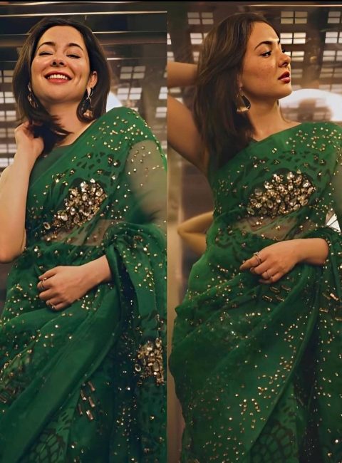 The Diva Hania Amir looks alluring in this emerald saree embellished with jewel stones. Hania Amir completed her look with loose hair and minimal jewelry.